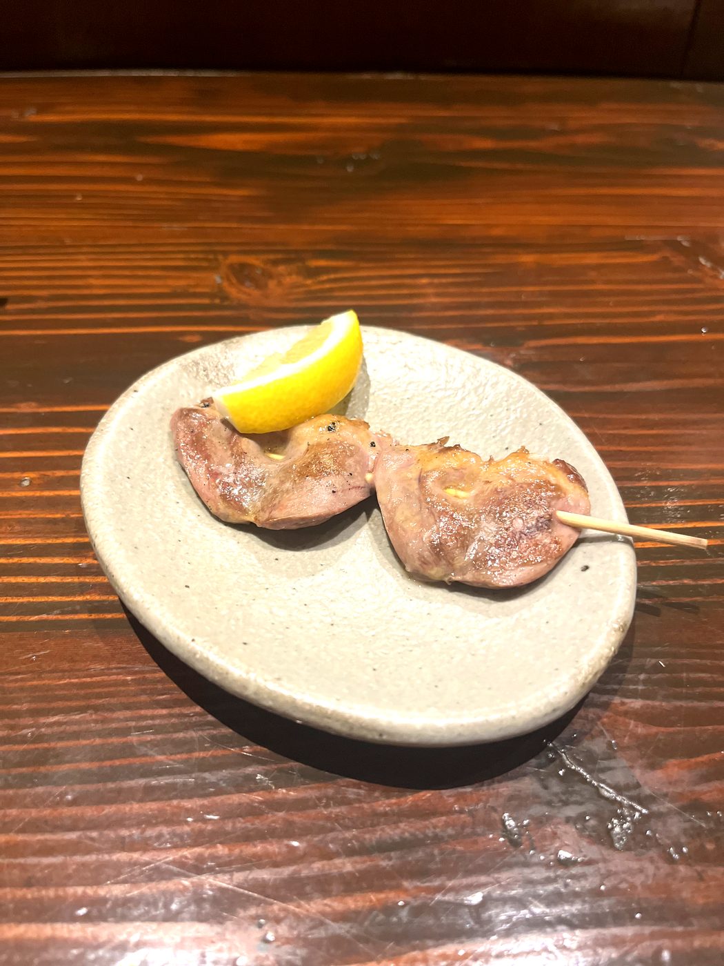 Hatsu (chicken heart) yakitori with lemon